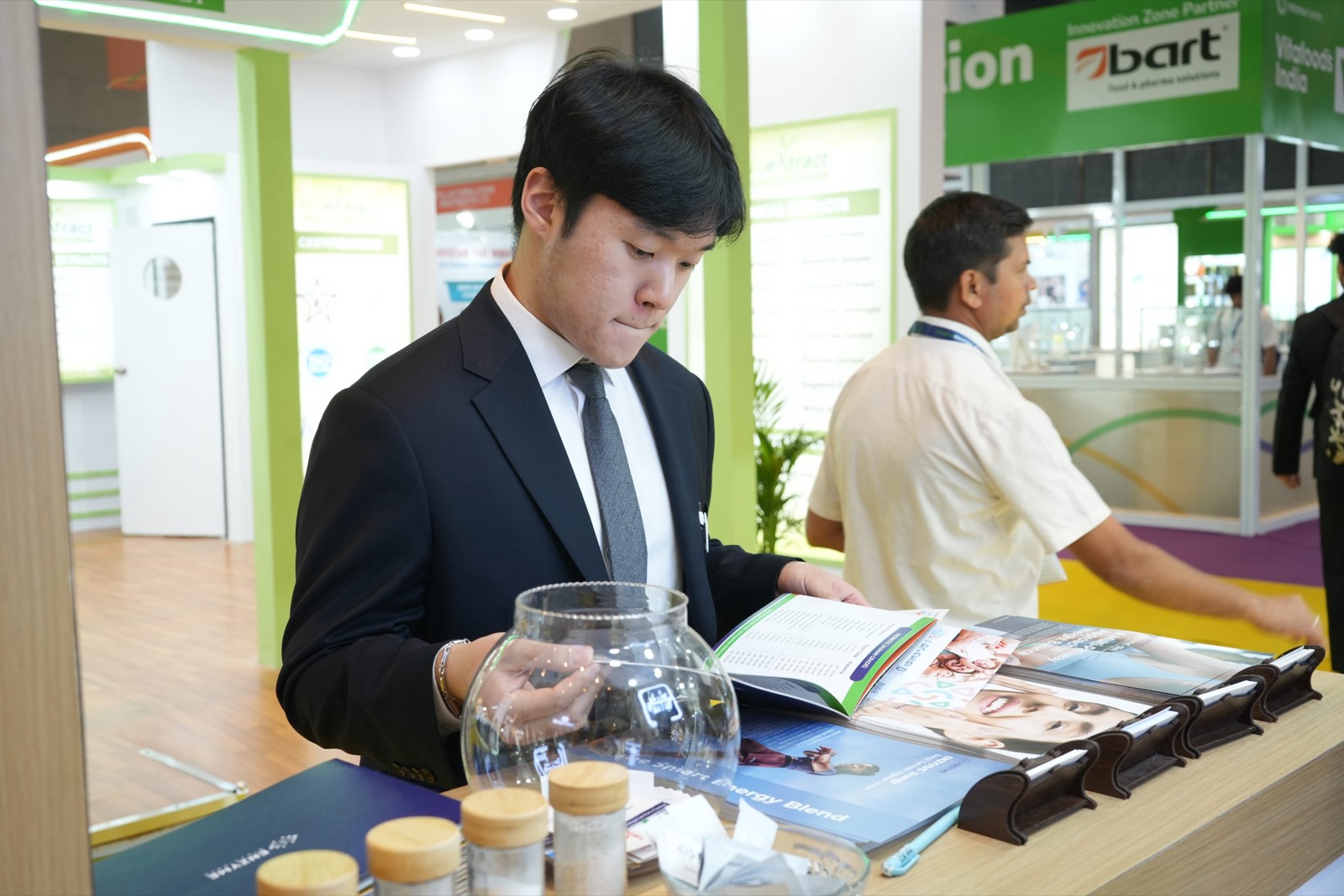 Visitor reading the product brochure
